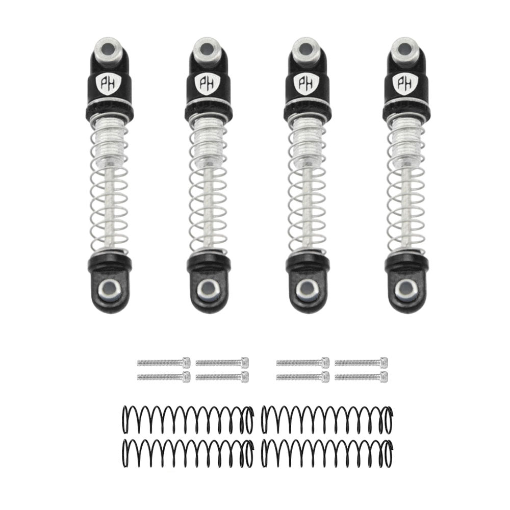 Four black shock absorbers with springs and hardware on a white background